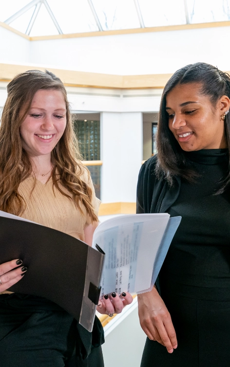 Two women reviewing a report