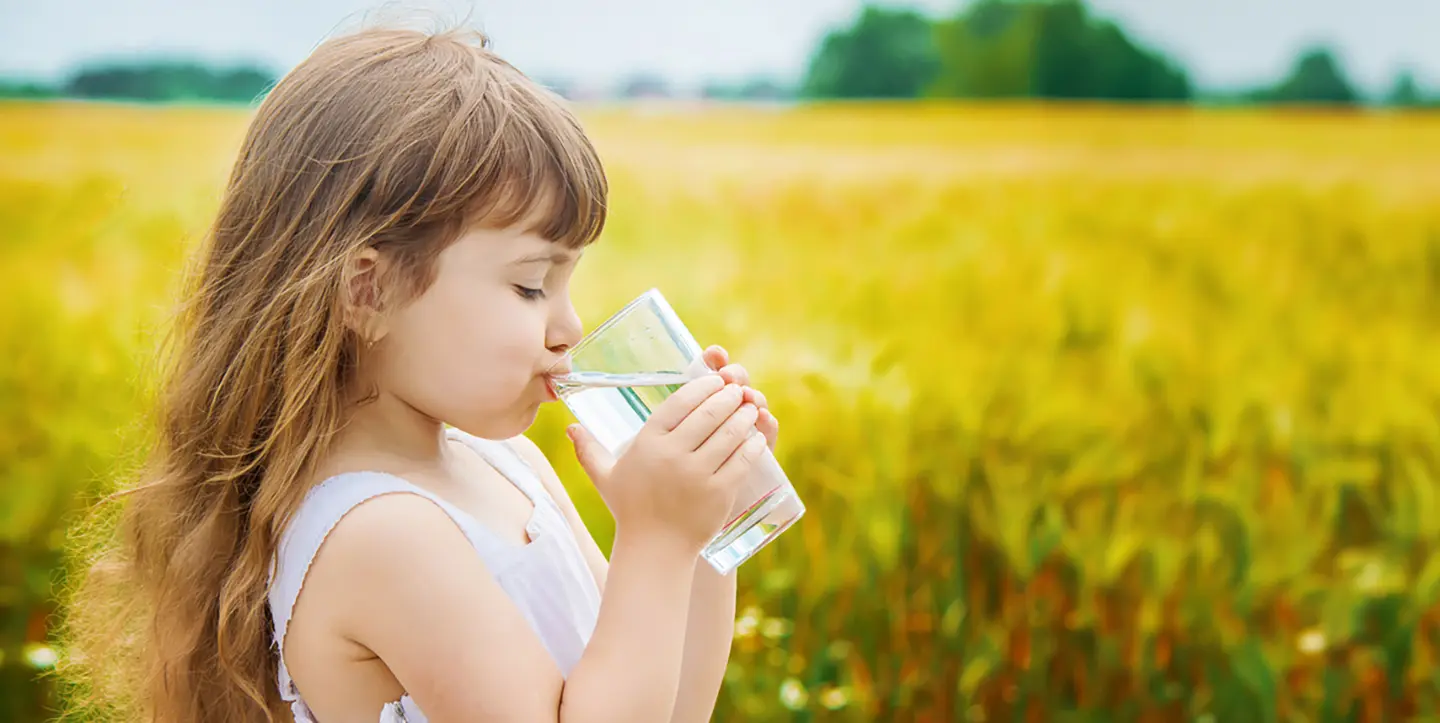 Young girl drinking clean water